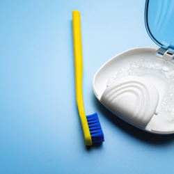 Clear aligners with case and toothbrush