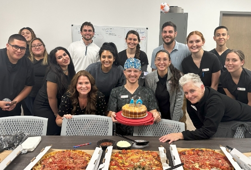 Team members with cake